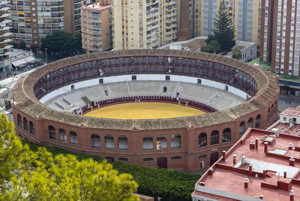 Historic bullring in city of Malaga surrounded by high rise apartments, Malaga, Andalusia, Spain,