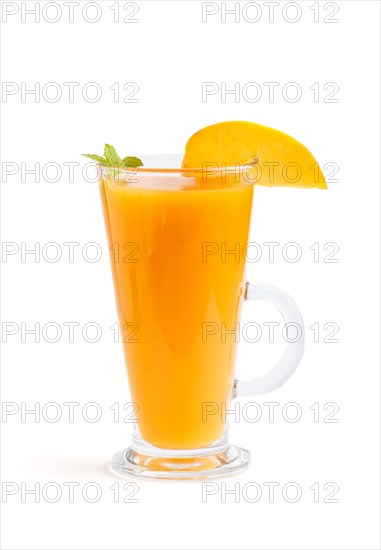 Glass of peach juice isolated on white background. Morninig, spring, healthy drink concept. Side