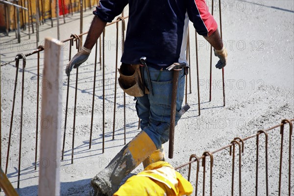 Concreting a floor slab with ready-mixed concrete on the construction site of a residential