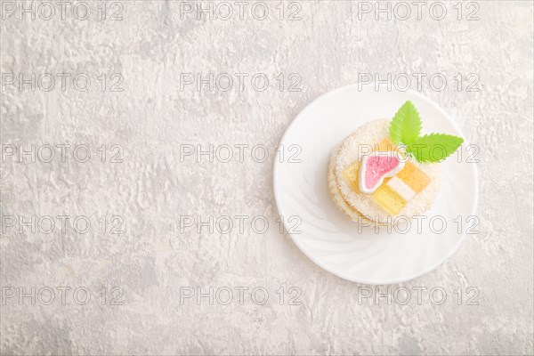 Decorated cake with milk and coconut cream on a gray concrete background. top view, flat lay, copy