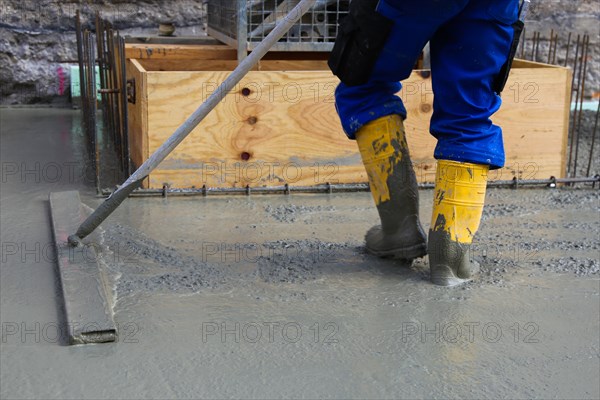 Concreting a floor slab with ready-mixed concrete on the construction site of a residential