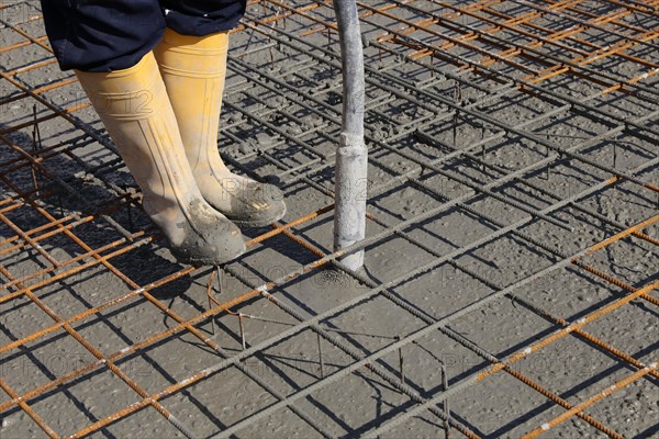 Concreting a floor slab with ready-mixed concrete on the construction site of a residential