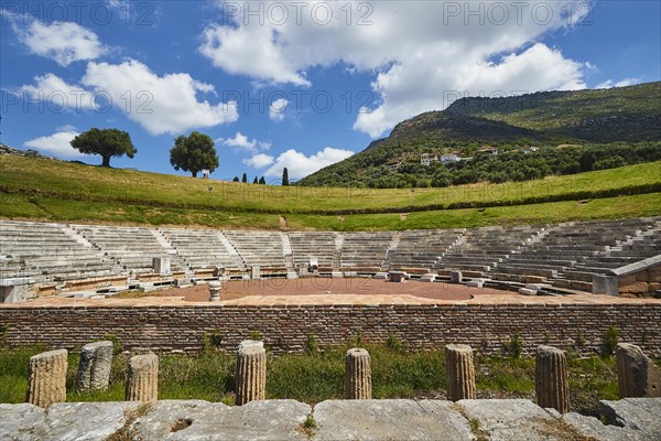 Ancient theatre with semi-circular rows of seats and stage, surrounded by nature, Ancient theatre,
