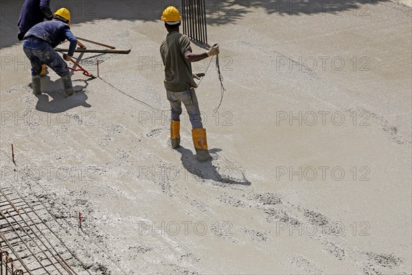 Concreting a floor slab with ready-mixed concrete on the construction site of a residential