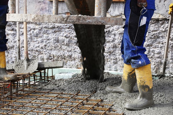 Concreting a floor slab with ready-mixed concrete on the construction site of a residential
