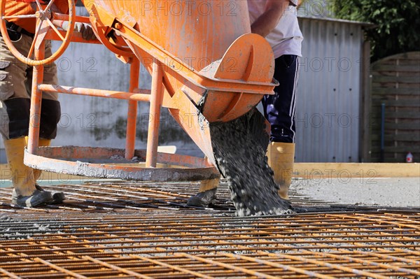 Concreting a floor slab with ready-mixed concrete on the construction site of a residential