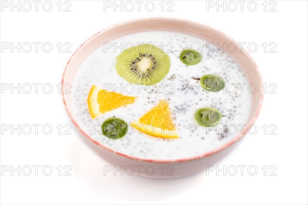 Yogurt with kiwi, gooseberry, chia in ceramic bowl isolated on white background. Side view, close