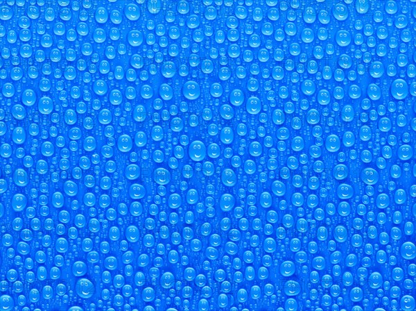 Many water drops on a blue surface, a smiley face is reflected in every drop