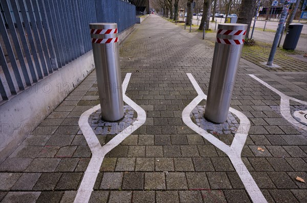 Automatic bollards, with white markings for smartphone junkies, Stuttgart, Baden-Wuerttemberg,