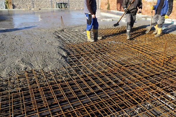 Concreting a floor slab with ready-mixed concrete on the construction site of a residential