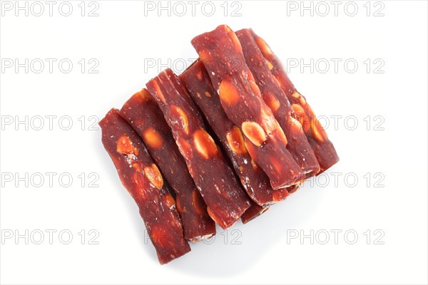 Brown traditional turkish delight (rahat lokum) with peanuts isolated on white background. top