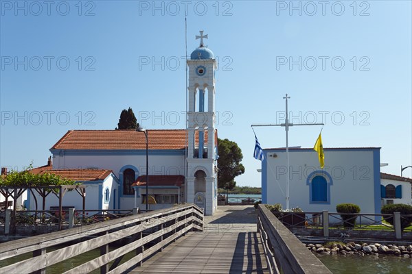 Church during the day with blue sky and access via a wooden bridge, Monastery of St Nicholas,