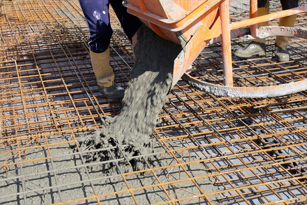 Concreting a floor slab with ready-mixed concrete on the construction site of a residential