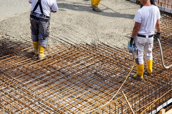 Delivery of ready-mixed concrete to the construction site of a residential building in a new