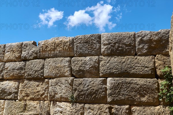 Detail of an old stone wall with visible stone structures, Archaeological site, Ancient Messene,