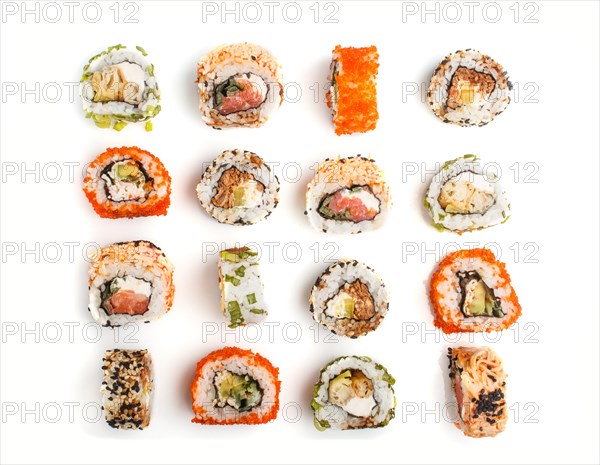Set of Japanese maki sushi rolls in a rows with salmon, sesame, avocado, cheese and cucumber