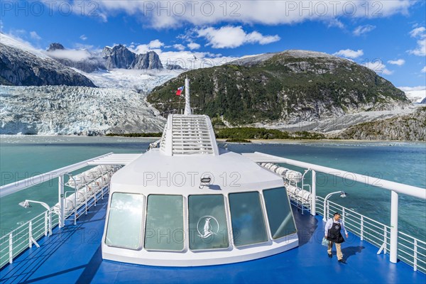 Cruise ship Stella Australis anchors in front of the Pia Glacier, Alberto de Agostini National