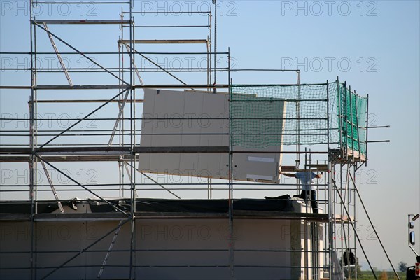 Prefabricated house under construction, the exterior walls are being delivered (Bad Duerkheim,