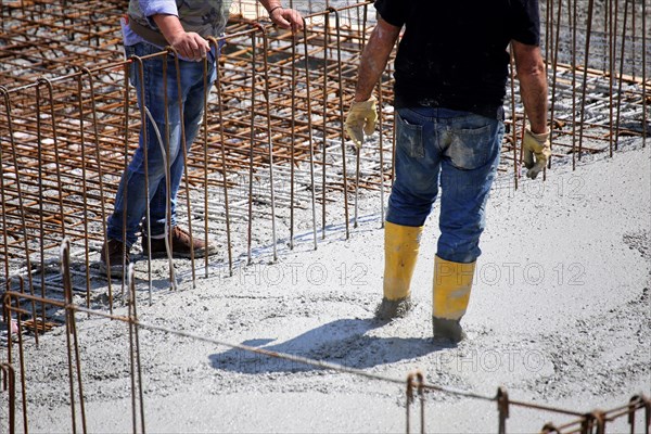 Concreting a floor slab with ready-mixed concrete on the construction site of a residential