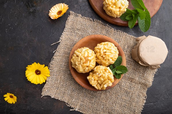 Traditional Tatar candy chak-chak made of dough and honey with cup of coffee on a black concrete