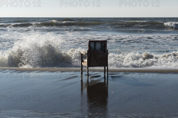 Upholstered chair washed up on the North Sea shore, flotsam, Oksbol, Region Syddanmark, Denmark,