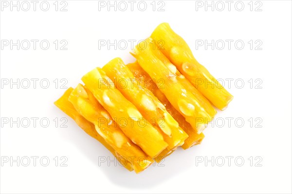 Yellow traditional turkish delight (rahat lokum) with peanuts isolated on white background. top