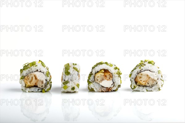 Four Japanese maki sushi rolls in a row with cream cheese and onion isolated on white background