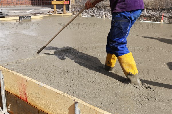 Concreting a floor slab with ready-mixed concrete on the construction site of a residential