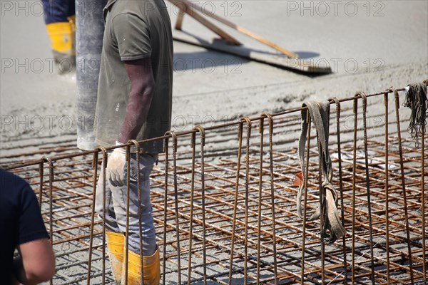 Concreting a floor slab with ready-mixed concrete on the construction site of a residential