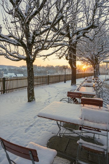 Snow-covered beer garden in winter, sunset, Andechs Monastery, Fuenfseenland, Pfaffenwinkel, Upper