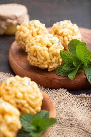 Traditional Tatar candy chak-chak made of dough and honey with cup of coffee on a black concrete