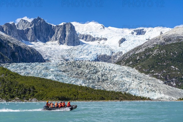 Passengers of the cruise ship Stella Australis travelling in a rubber dinghy in front of the Pia