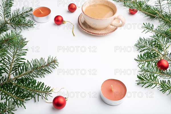 Christmas or New Year frame composition. Decorations, red balls, fir and spruce branches, cup of