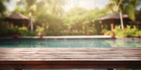 Wooden table with troical garden and swimming pool in blurry background. KI generiert, generiert AI