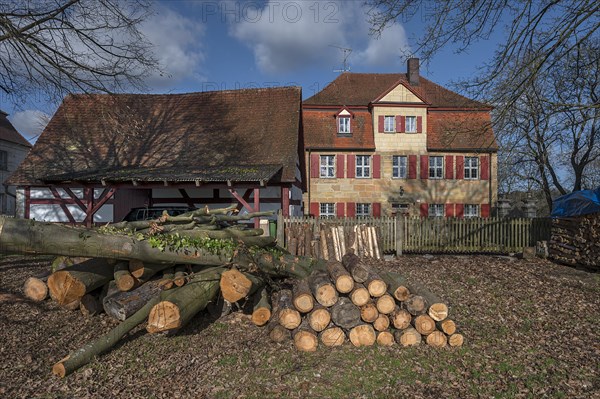 Historic vicarage from 1734 of St Egidien Church, in front the trunk of a beech (Fagus), Beerbach,
