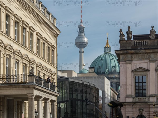 View of historic buildings in the foreground with the Berlin television tower in the background