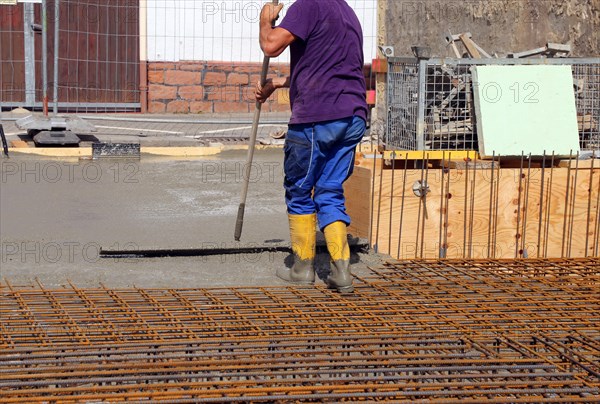 Concreting a floor slab with ready-mixed concrete on the construction site of a residential