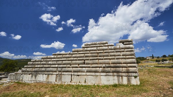 Steps of an ancient theatre under a blue sky in Greece, Archaeological site, Ancient Messene,