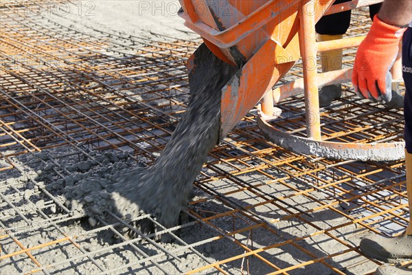 Concreting a floor slab with ready-mixed concrete on the construction site of a residential