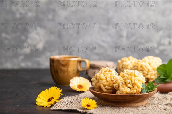 Traditional Tatar candy chak-chak made of dough and honey with cup of coffee on a black concrete