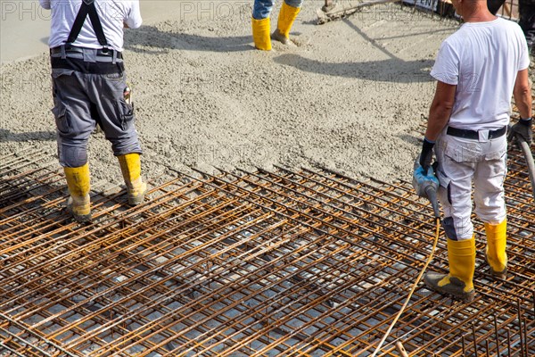 Delivery of ready-mixed concrete to the construction site of a residential building in a new