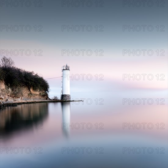 The Maltzien lighthouse stands at the foot of a small cliff at the southern tip of the Zudar