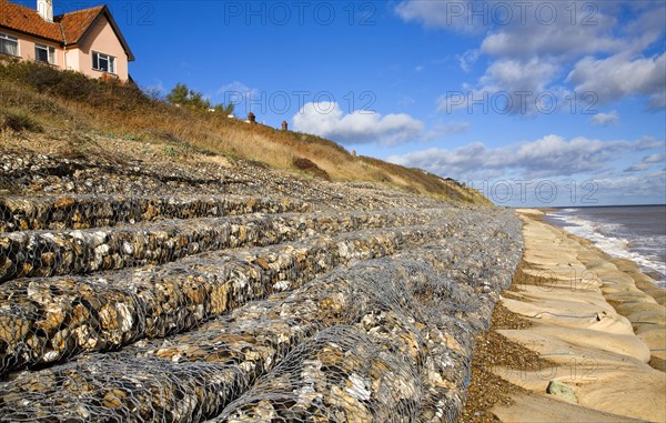 Coastal defences normally covered by shingle exposed by winter storms at Thorpeness, Suffolk,