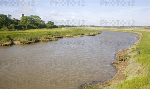 View upstream of levees and flood plain of tidal River Blyth, Blythburgh, Suffolk, England, United