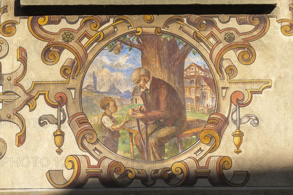 Stein am Rhein, historic old town, Haus Buerger-Asyl, old man, boy, apple, bench, wall painting,