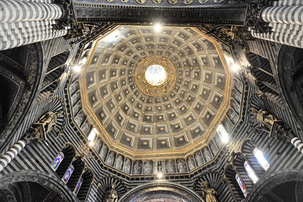 The dome of the cathedral with starry sky and black and white striped marble columns and round