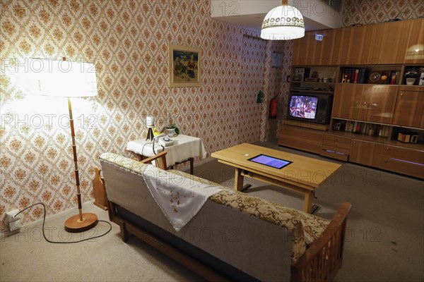 View into a living room of a prefabricated flat in the DDR Museum. The DDR Museum shows the life