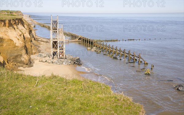 Former beach access stairs and old sea defences at Happisburgh, Norfolk, England, United Kingdom,
