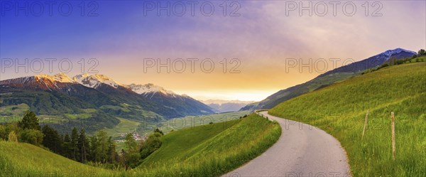 Mountain panorama of a small road in the South Tyrolean Alps, sunset, evening mood, path, Goldrain,