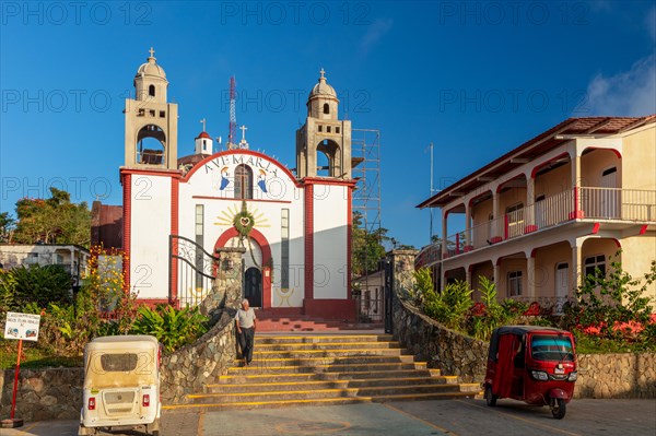 Motorbike taxi in front of the Inglesia Ave Maria church, Pluma Hidalgo, Pochutla, Oxaca state,